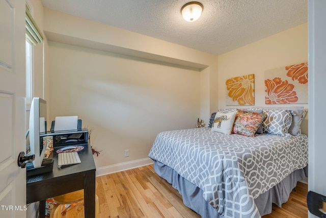 309 Crouch Rd, Gray, TN 37615 - bedroom featuring light wood-type flooring, a textured ceiling, and baseboards