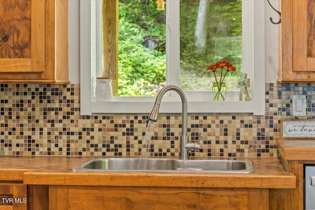 108 Chock Creek Rd, Johnson City, TN 37601 - kitchen with a sink, decorative backsplash, tile countertops, and brown cabinetry