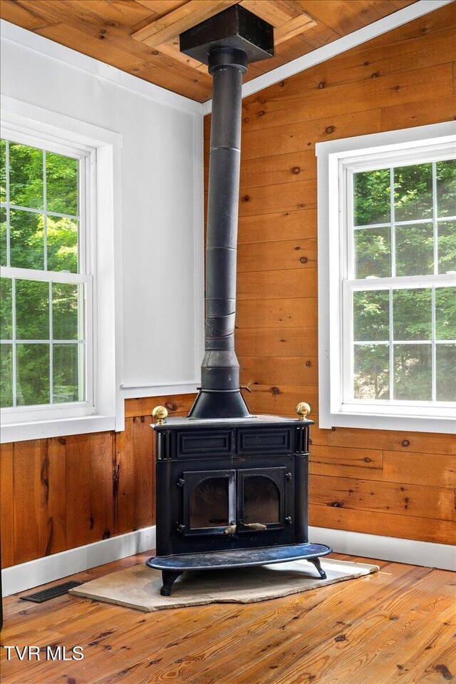 108 Chock Creek Rd, Johnson City, TN 37601 - detailed view of a wood stove, wood walls, wood finished floors, and wooden ceiling
