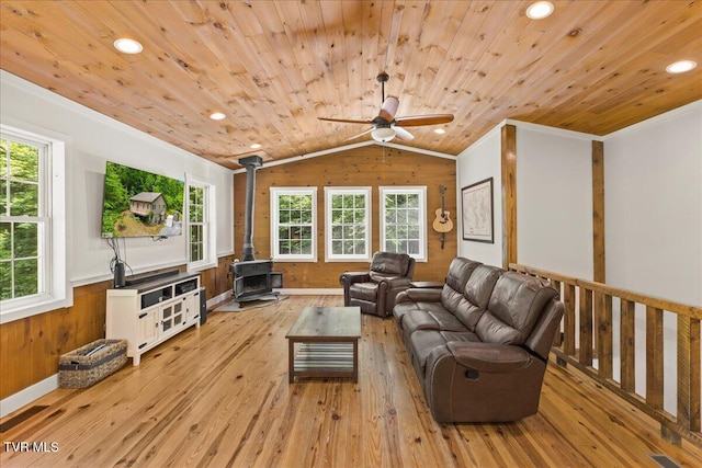 108 Chock Creek Rd, Johnson City, TN 37601 - living room featuring a wood stove, light wood finished floors, wood ceiling, ornamental molding, and ceiling fan
