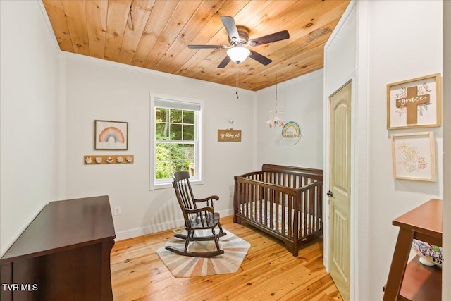 108 Chock Creek Rd, Johnson City, TN 37601 - bedroom with wood ceiling, a crib, light wood-style flooring, and crown molding