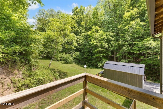 108 Chock Creek Rd, Johnson City, TN 37601 - view of green lawn with a wooded view, an outdoor structure, and a shed