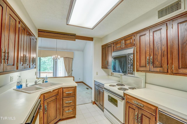 153 Columbine Rd, Kingsport, TN 37660 - kitchen with white appliances, a sink, a chandelier, light countertops, and brown cabinetry