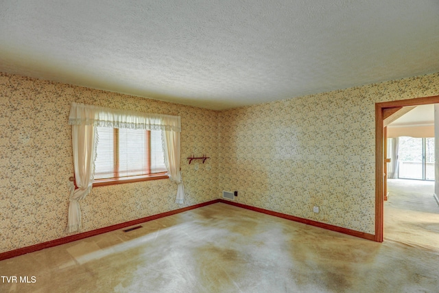 153 Columbine Rd, Kingsport, TN 37660 - spare room with wallpapered walls, a textured ceiling, and carpet