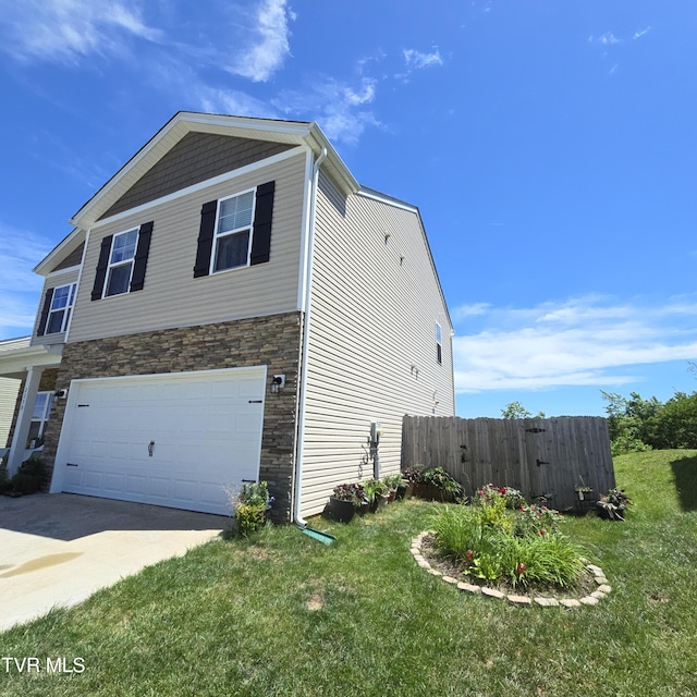 2358 Stream View Ln, Morristown, TN 37814 - view of side of home featuring a garage, stone siding, and driveway