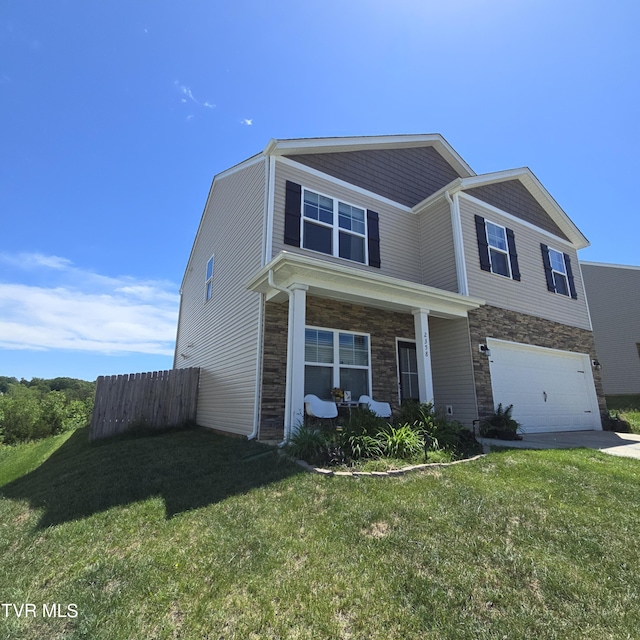 2358 Stream View Ln, Morristown, TN 37814 - view of front of home featuring stone siding, a garage, covered porch, and driveway