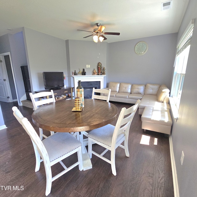 2358 Stream View Ln, Morristown, TN 37814 - dining area with a ceiling fan, wood finished floors, a fireplace, and baseboards