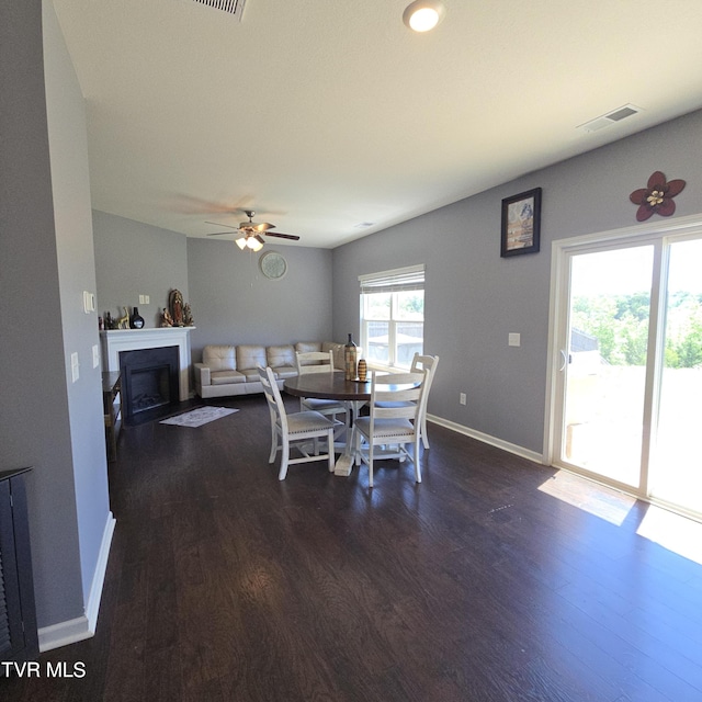 2358 Stream View Ln, Morristown, TN 37814 - dining area with dark wood-type flooring, a fireplace, baseboards, and ceiling fan