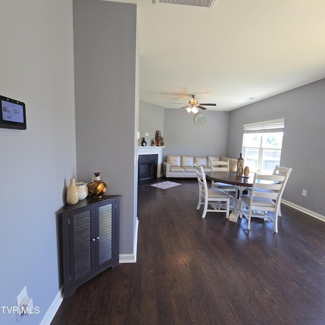 2358 Stream View Ln, Morristown, TN 37814 - dining space featuring wood finished floors, a ceiling fan, baseboards, and a fireplace