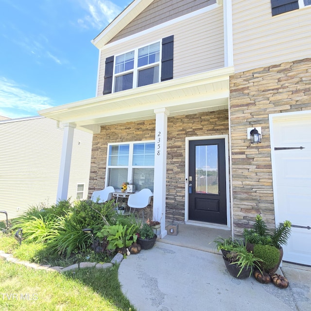2358 Stream View Ln, Morristown, TN 37814 - doorway to property featuring stone siding and a porch