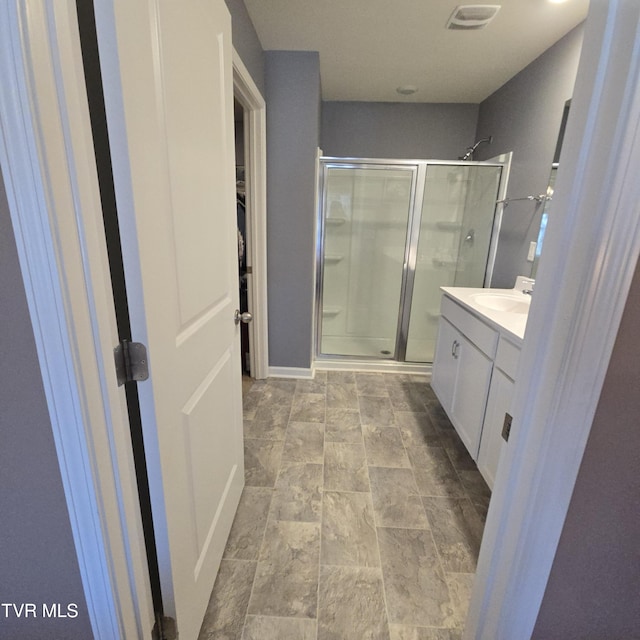 2358 Stream View Ln, Morristown, TN 37814 - bathroom with a stall shower, vanity, and a spacious closet