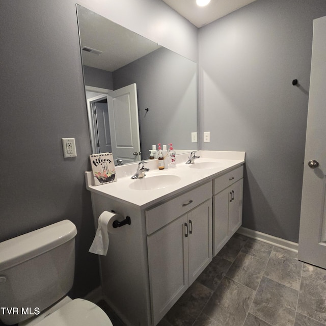 2358 Stream View Ln, Morristown, TN 37814 - bathroom with toilet, double vanity, baseboards, and stone finish floors