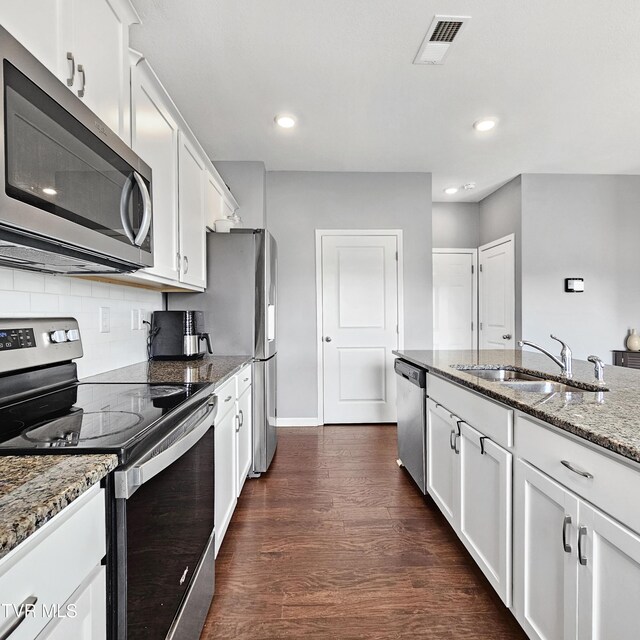 2358 Stream View Ln, Morristown, TN 37814 - kitchen featuring stainless steel appliances, a sink, dark wood-type flooring, stone counters, and white cabinetry