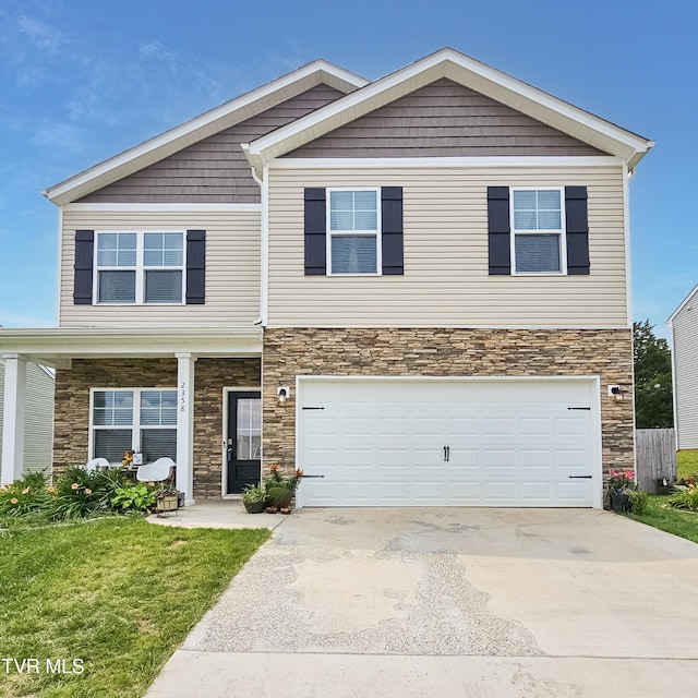 2358 Stream View Ln, Morristown, TN 37814 - view of front of house featuring stone siding, concrete driveway, an attached garage, and a front lawn