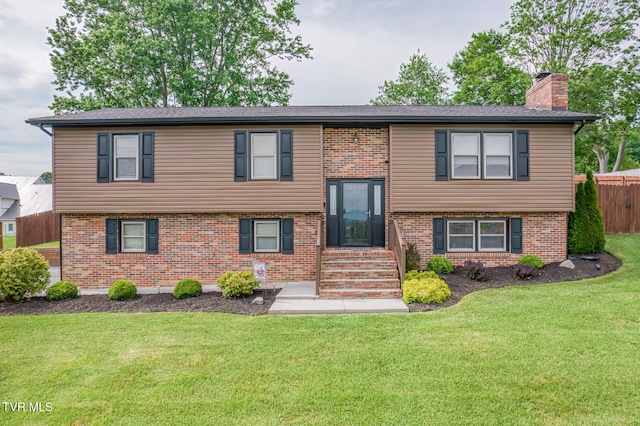 115 Dover Ln, Bristol, TN 37620 - split foyer home featuring a chimney, brick siding, and entry steps
