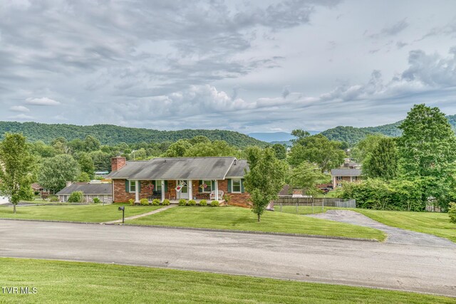 115 Dover Ln, Bristol, TN 37620 - ranch-style home featuring a chimney, a porch, brick siding, and a mountain view