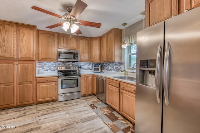115 Dover Ln, Bristol, TN 37620 - kitchen with stainless steel appliances, a sink, tasteful backsplash, and light countertops