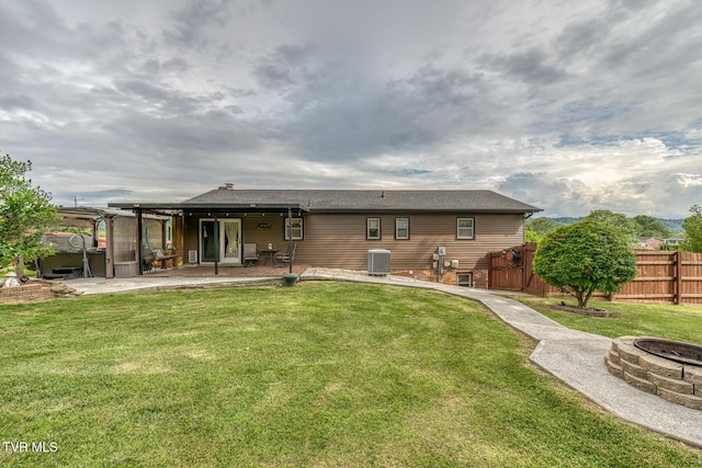115 Dover Ln, Bristol, TN 37620 - rear view of property with a covered hot tub, a fire pit, central AC, and a patio area