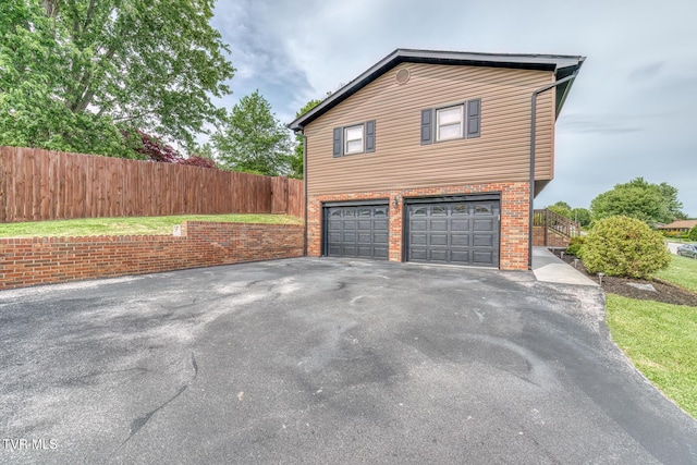 115 Dover Ln, Bristol, TN 37620 - view of property exterior with a garage, driveway, and brick siding