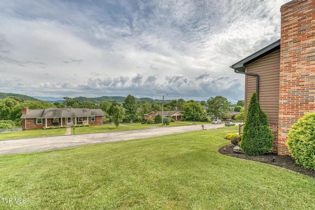 115 Dover Ln, Bristol, TN 37620 - view of green lawn featuring a mountain view and driveway