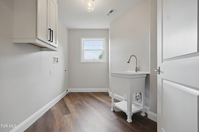5541 Hester Ct, Piney Flats, TN 37686 - laundry room featuring cabinet space, hookup for an electric dryer, washer hookup, dark wood finished floors, and baseboards
