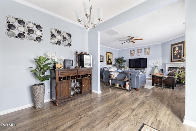 478 Brinkleys Way, Johnson City, TN 37615 - living area with crown molding, wood finished floors, ceiling fan, a chandelier, and baseboards