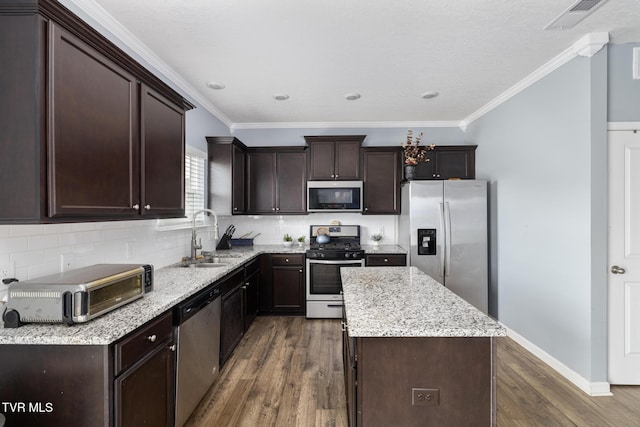 478 Brinkleys Way, Johnson City, TN 37615 - kitchen with stainless steel appliances, a sink, dark wood-style flooring, a kitchen island, and dark brown cabinetry
