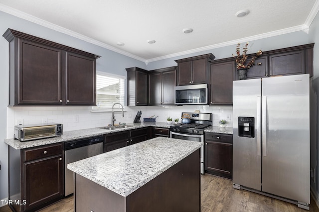 478 Brinkleys Way, Johnson City, TN 37615 - kitchen featuring stainless steel appliances, a sink, dark brown cabinets, wood finished floors, and decorative backsplash