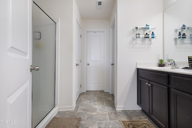 478 Brinkleys Way, Johnson City, TN 37615 - full bathroom featuring baseboards, stone finish floors, vanity, and a shower stall