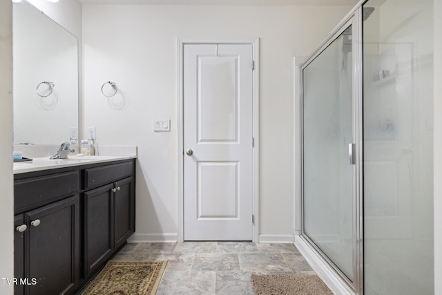 478 Brinkleys Way, Johnson City, TN 37615 - full bathroom featuring vanity, a shower stall, baseboards, and stone finish floors