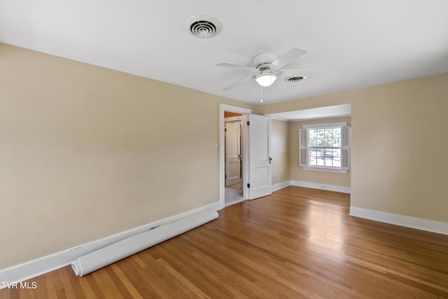 108 S Rogers St, Rogersville, TN 37857 - spare room featuring a ceiling fan, light wood-style floors, and baseboards