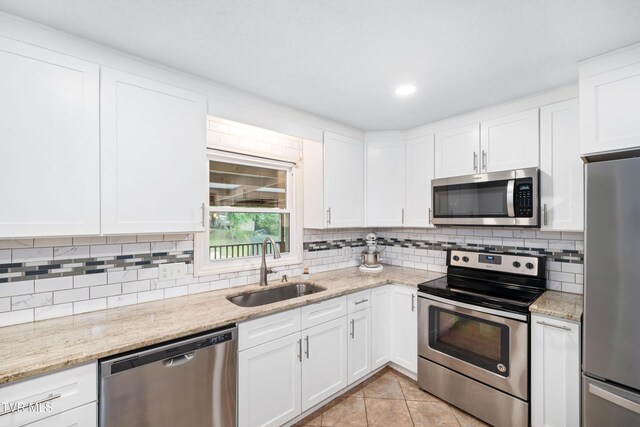 137 Highland Rd, Jonesborough, TN 37659 - kitchen featuring stainless steel appliances, a sink, backsplash, white cabinetry, and recessed lighting