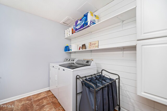 137 Highland Rd, Jonesborough, TN 37659 - laundry room with washer and clothes dryer, cabinet space, baseboards, and stone finish floors