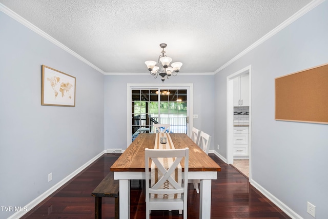 137 Highland Rd, Jonesborough, TN 37659 - dining space with a chandelier, crown molding, a textured ceiling, dark wood-style flooring, and baseboards