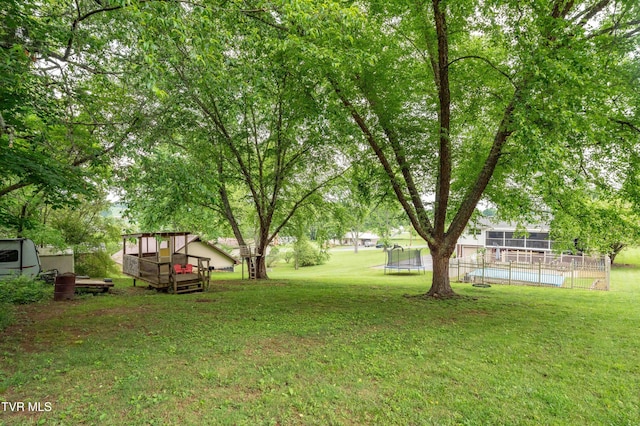 137 Highland Rd, Jonesborough, TN 37659 - view of green lawn with an outdoor pool and a trampoline