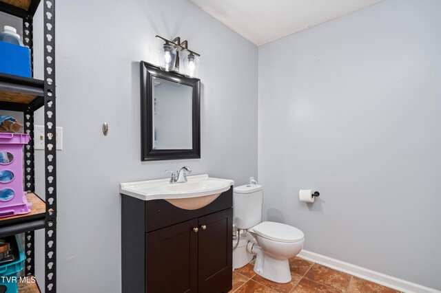 137 Highland Rd, Jonesborough, TN 37659 - bathroom with baseboards, toilet, and vanity