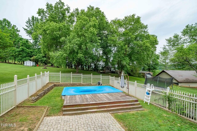 137 Highland Rd, Jonesborough, TN 37659 - view of pool with a deck, a storage shed, an outdoor structure, and view of wooded area