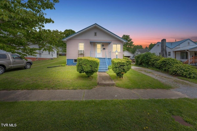 648 Maple Ave, Erwin, TN 37650 - bungalow-style house featuring a front yard and cooling unit