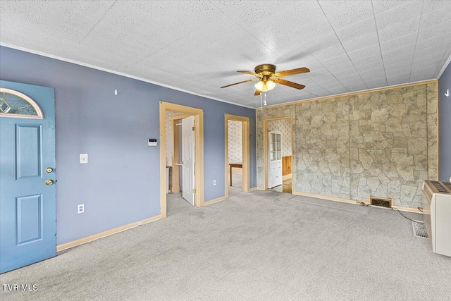 648 Maple Ave, Erwin, TN 37650 - unfurnished living room with a ceiling fan, carpet, baseboards, and crown molding