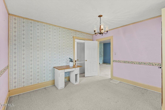648 Maple Ave, Erwin, TN 37650 - unfurnished dining area featuring a chandelier, crown molding, baseboards, carpet floors, and a textured ceiling