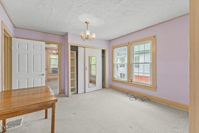 648 Maple Ave, Erwin, TN 37650 - carpeted foyer entrance with a chandelier, cooling unit, baseboards, and a textured ceiling