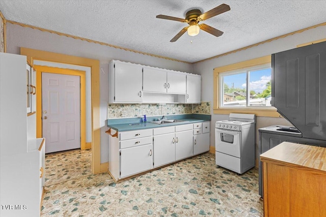 648 Maple Ave, Erwin, TN 37650 - kitchen with gas range gas stove, a ceiling fan, white cabinets, a sink, and a textured ceiling