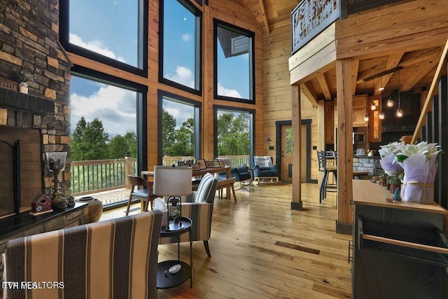 833 Duck Creek Rd, Sneedville, TN 37869 - living area featuring high vaulted ceiling, wood walls, hardwood / wood-style floors, and wooden ceiling