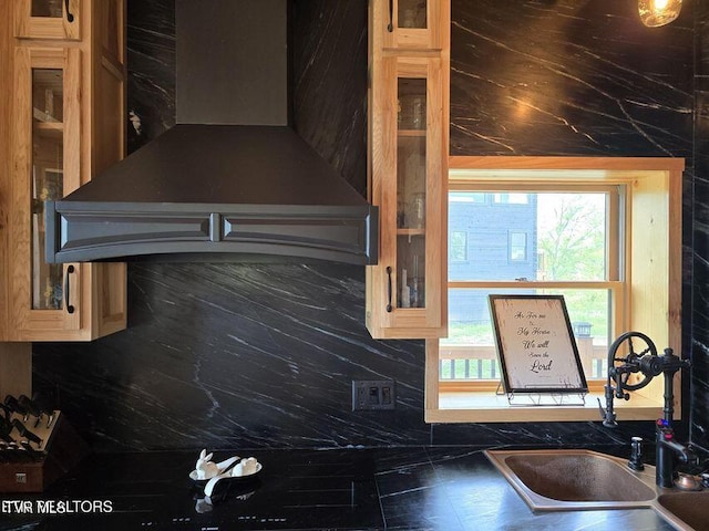 833 Duck Creek Rd, Sneedville, TN 37869 - kitchen featuring wall chimney range hood, a sink, glass insert cabinets, and dark countertops