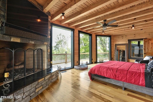833 Duck Creek Rd, Sneedville, TN 37869 - bedroom featuring access to exterior, wood finished floors, wooden ceiling, beamed ceiling, and wood walls