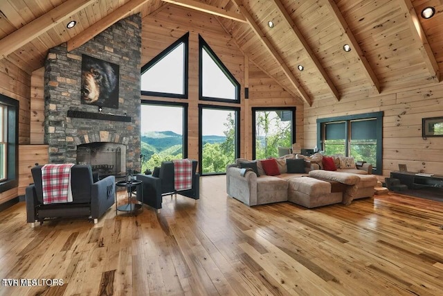 833 Duck Creek Rd, Sneedville, TN 37869 - living room featuring high vaulted ceiling, wood ceiling, hardwood / wood-style flooring, beamed ceiling, and a fireplace