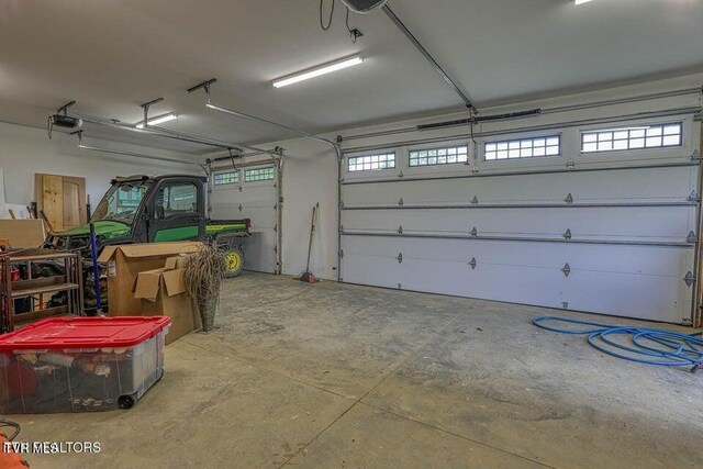 833 Duck Creek Rd, Sneedville, TN 37869 - garage featuring a garage door opener