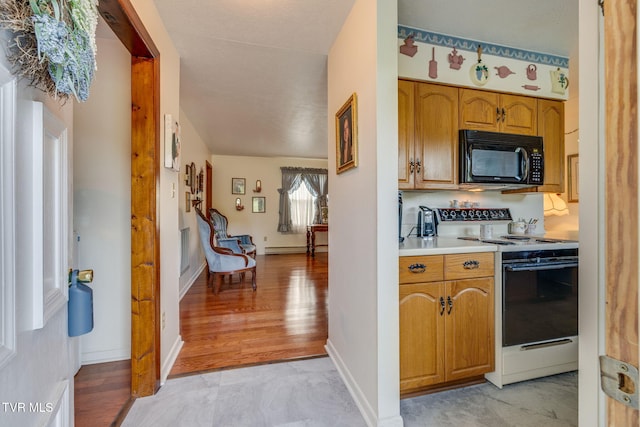 253 Fairford Ln, Blountville, TN 37617 - kitchen with electric stove, black microwave, light countertops, and baseboards