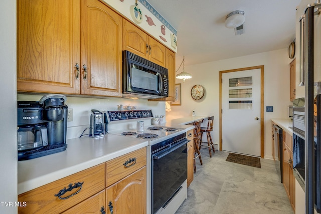 253 Fairford Ln, Blountville, TN 37617 - kitchen featuring black microwave, electric stove, and light countertops