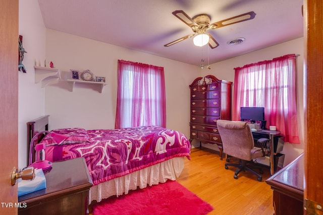 253 Fairford Ln, Blountville, TN 37617 - bedroom with multiple windows, wood finished floors, a ceiling fan, and an office area